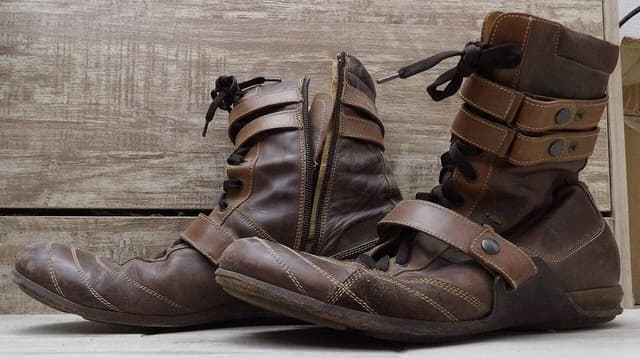 Brown leather lace-up boots with snap straps, men's 10