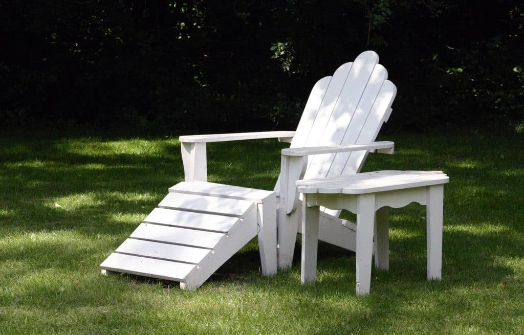 Wooden Adirondack chair with ottoman and side table