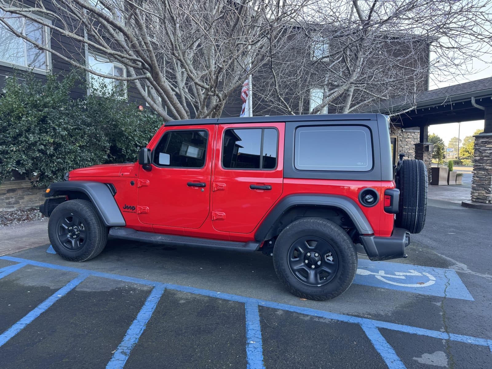2024 Jeep Wrangler four door, red with black hardtop