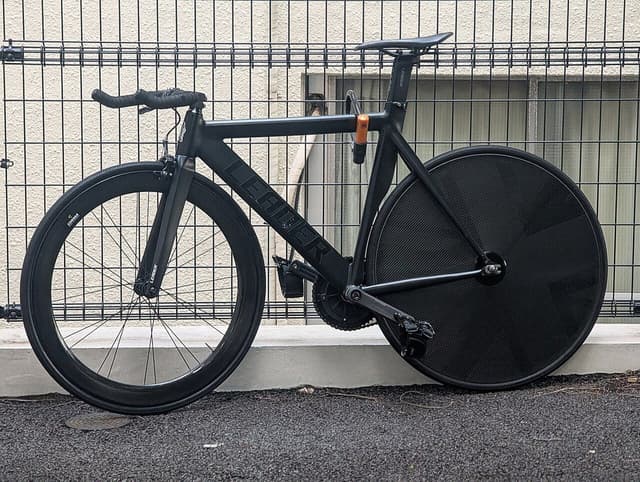 Leader track bike with carbon disc rear wheel